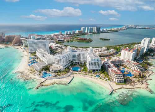 Hotels and resorts line the Cancun waterfront in what is known as the hotel zone. Credit: Depositphotos